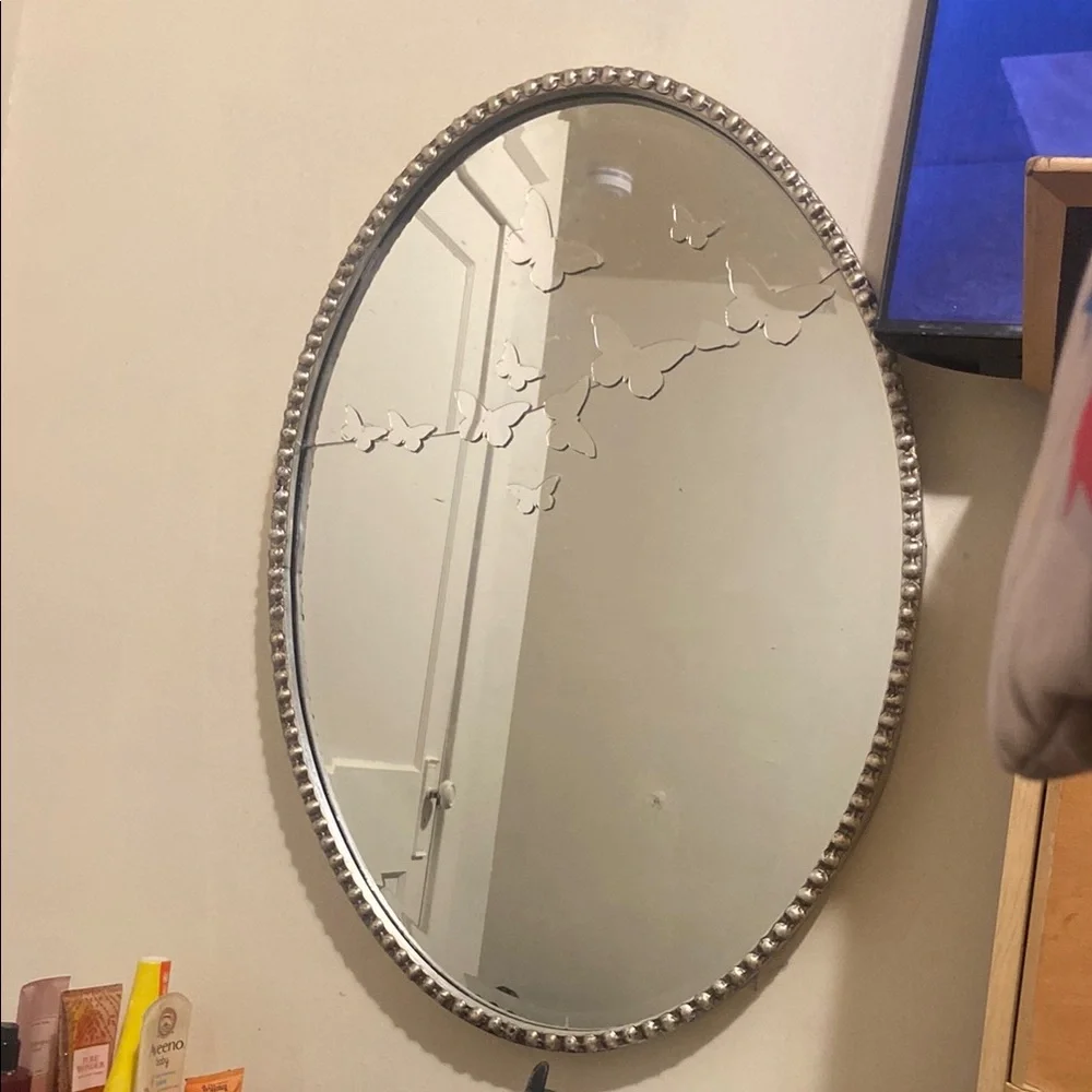 Elegant Silver Oval Mirror with Butterfly Design